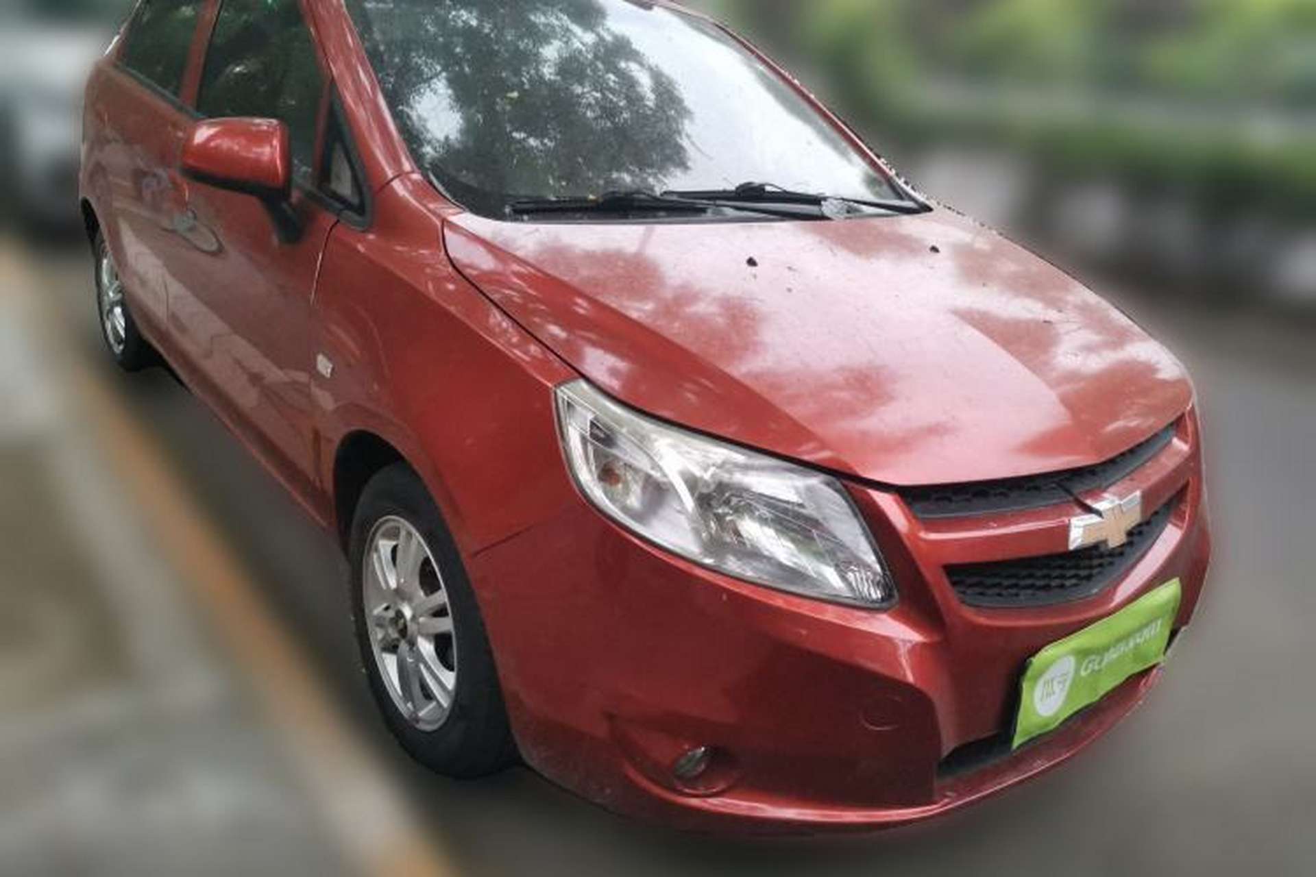 Used Chevrolet Sail 2011 Sedan 1.4L AMT Happiness Edition Front Right 45 Deg