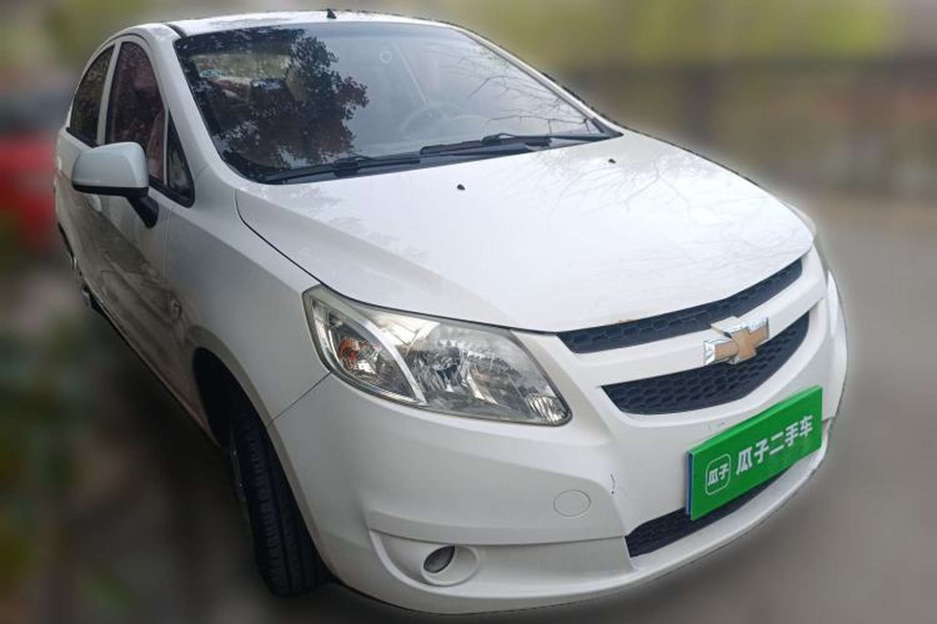 Used Chevrolet Sail 2011 Sedan 1.4L AMT Happiness Edition Front Right 45 Deg