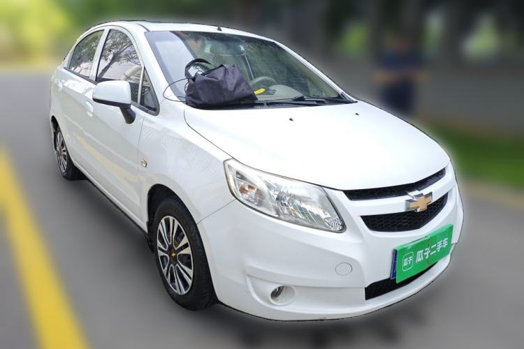 Used Chevrolet Sail 2011 Sedan 1.4L AMT Happiness Edition Front Right 45 Deg