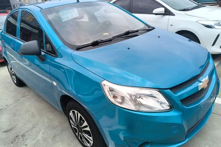 Used Chevrolet Sail 2013 Sedan 1.4L Manual Ideal Happiness Edition Front Right 45 Deg