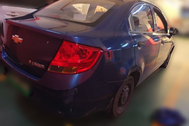 Used Chevrolet Sail 2013 Sedan 1.2L Manual Fashionable Happiness Edition Rear Right 45 Deg