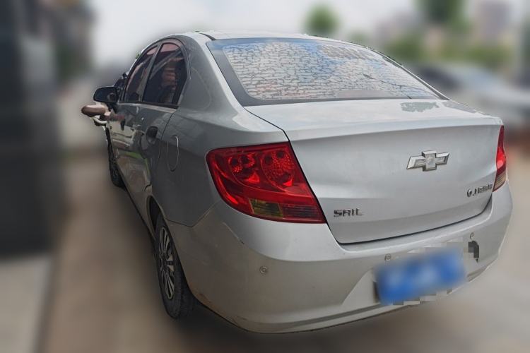 Used Chevrolet Sail 2013 Sedan 1.2L Manual Fashionable Happiness Edition Rear Left 45 Deg