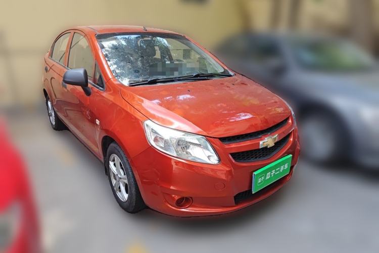 Used Chevrolet Sail 2013 Sedan 1.4L Manual Ideal Happiness Edition Front Right 45 Deg