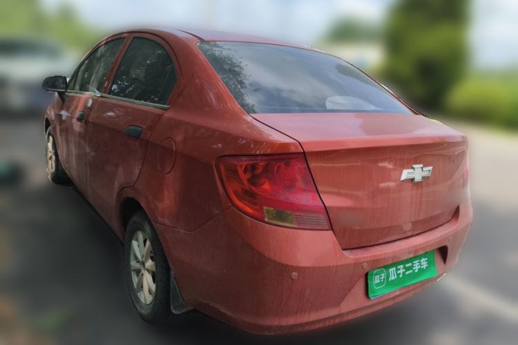 Used Chevrolet Sail 2013 Sedan 1.2L Manual Fashionable Happiness Edition Rear Left 45 Deg