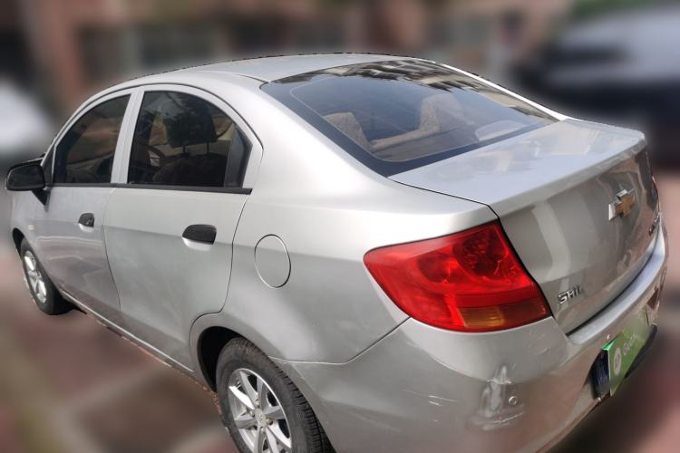 Used Chevrolet Sail 2013 Sedan 1.2L Manual Warm Edition Rear Left 45 Deg