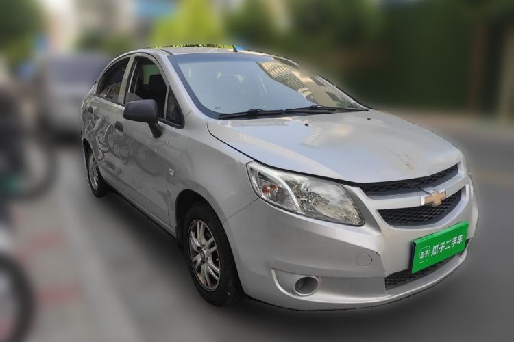 Used Chevrolet Sail 2013 Sedan 1.4L Manual Ideal Happiness Edition Front Right 45 Deg