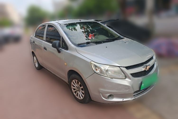 Used Chevrolet Sail 2013 Sedan 1.2L Manual Fashionable Happiness Edition Front Right 45 Deg