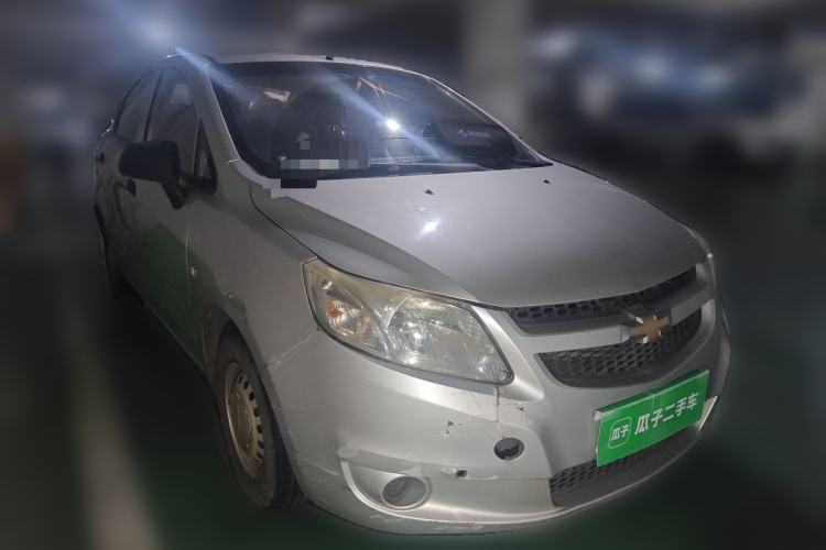 Used Chevrolet Sail 2013 Sedan 1.2L Manual Fashionable Happiness Edition Front Right 45 Deg