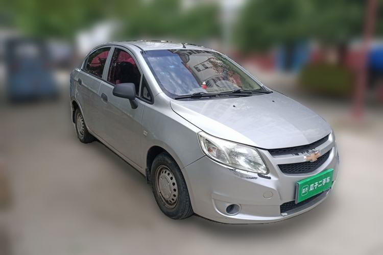 Used Chevrolet Sail 2013 Sedan 1.2L Manual Fashionable Happiness Edition Front Right 45 Deg