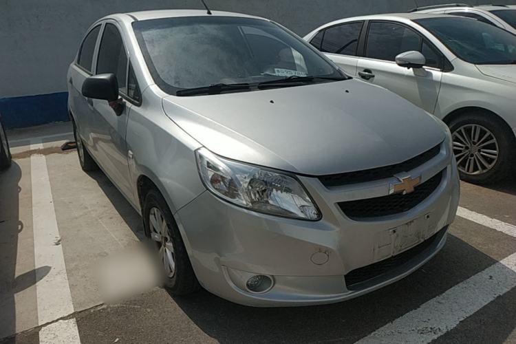 Used Chevrolet Sail 2013 Sedan 1.2L Manual Fashionable Happiness Edition Front Right 45 Deg