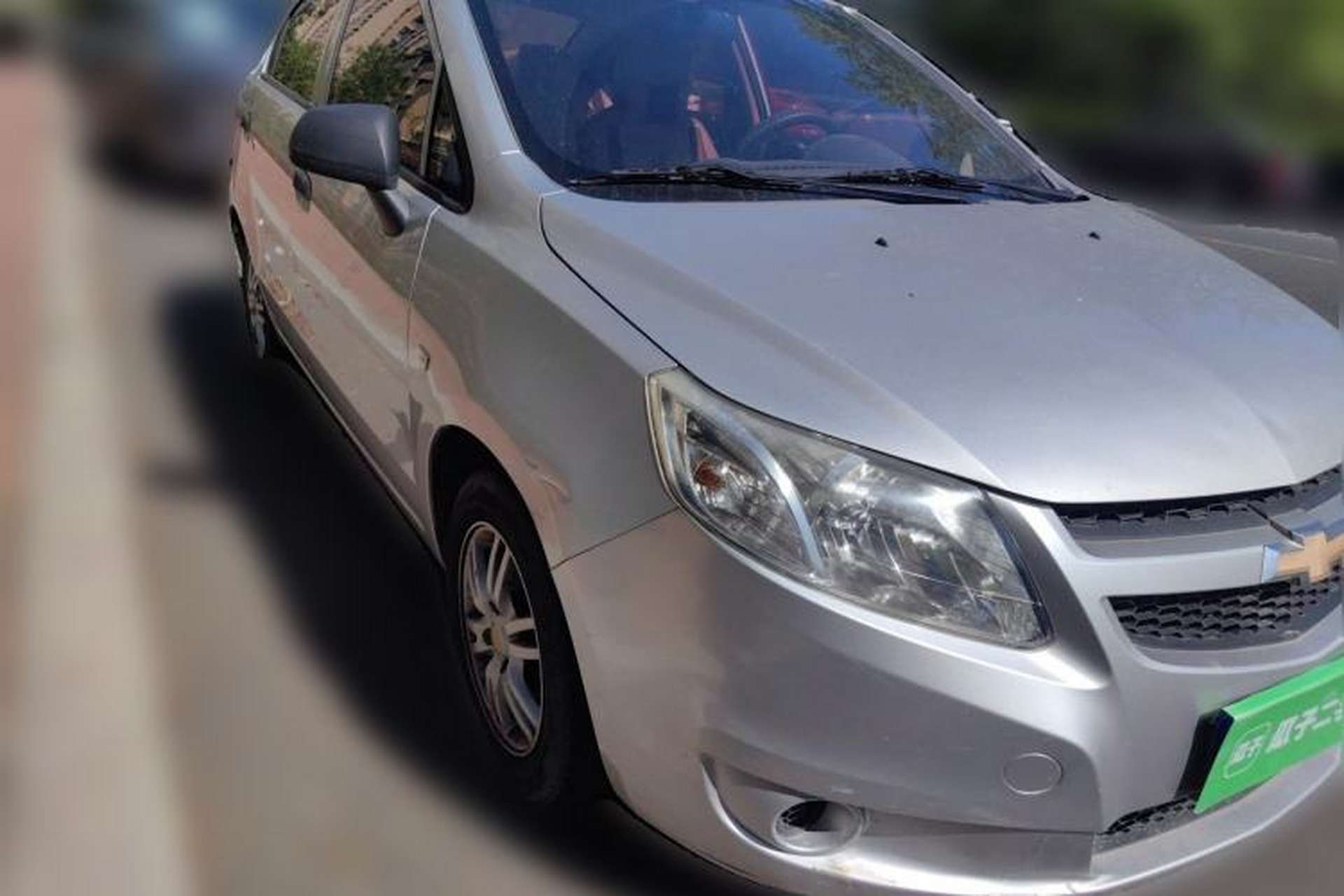 Used Chevrolet Sail 2013 Sedan 1.4L Manual Ideal Happiness Edition Front Right 45 Deg