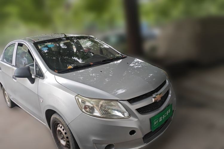 Used Chevrolet Sail 2013 Sedan 1.2L Manual Fashionable Happiness Edition Front Right 45 Deg