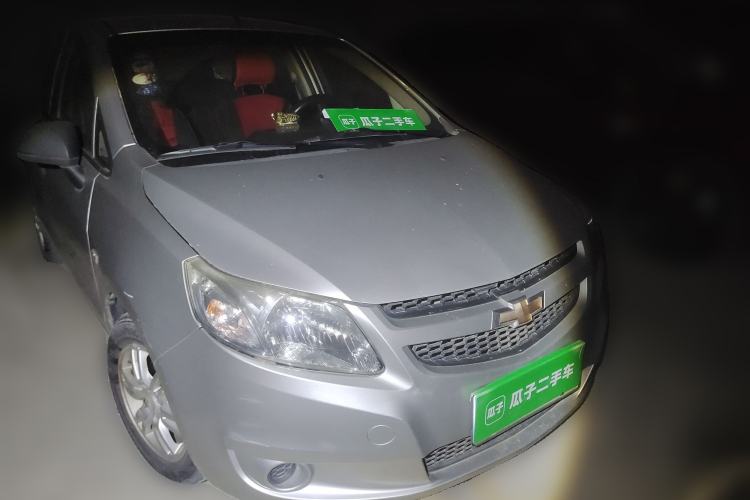 Used Chevrolet Sail 2013 Sedan 1.4L Manual Ideal Happiness Edition Front Right 45 Deg