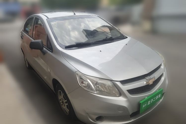 Used Chevrolet Sail 2013 Sedan 1.2L Manual Fashionable Happiness Edition Front Right 45 Deg