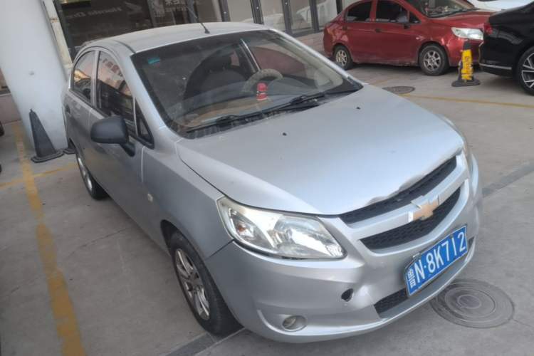 Used Chevrolet Sail 2013 Sedan 1.4L Manual Ideal Happiness Edition Front Right 45 Deg