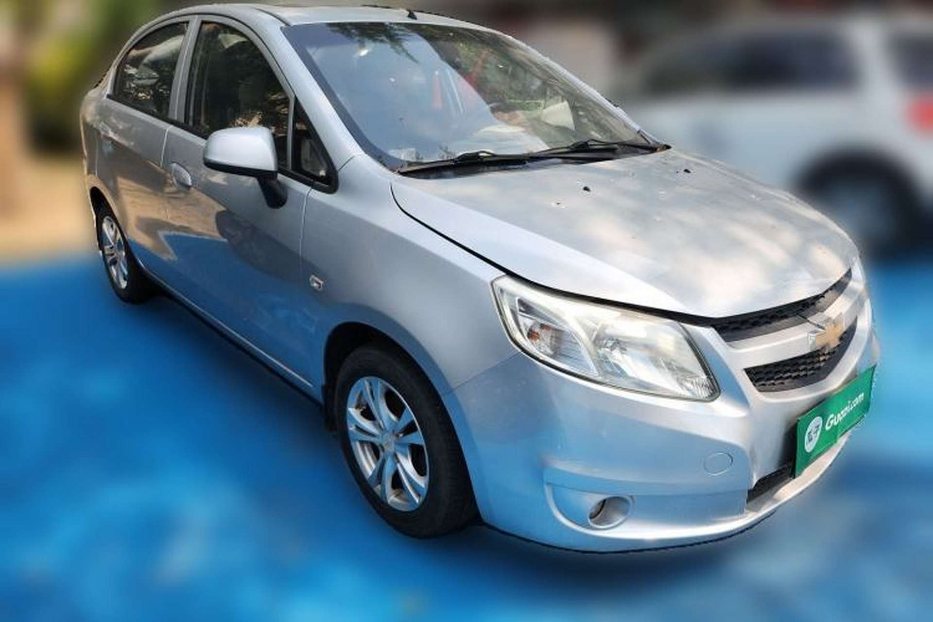 Used Chevrolet Sail 2013 Sedan 1.4L Manual Happiness Edition II Front Right 45 Deg