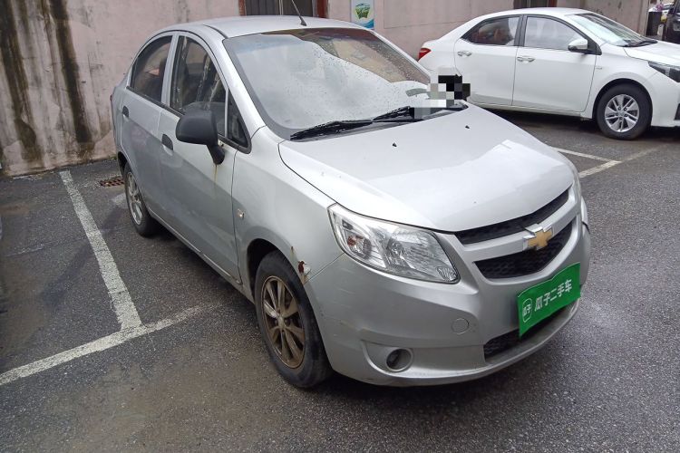Used Chevrolet Sail 2013 Sedan 1.2L Manual Fashionable Happiness Edition Front Right 45 Deg