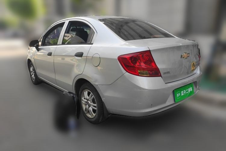 Used Chevrolet Sail 2013 Sedan 1.4L Manual Ideal Happiness Edition Rear Left 45 Deg