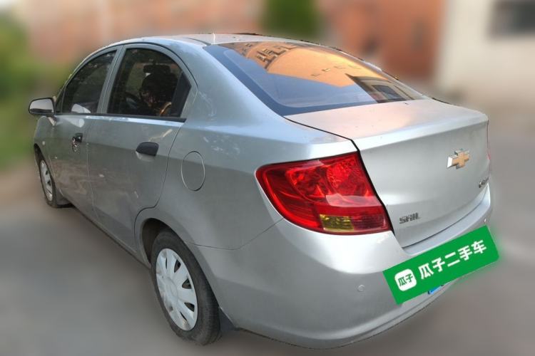 Used Chevrolet Sail 2013 Sedan 1.4L Manual Ideal Happiness Edition Rear Left 45 Deg