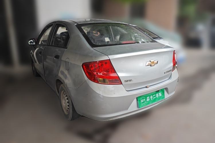 Used Chevrolet Sail 2013 Sedan 1.2L Manual Fashionable Happiness Edition Rear Left 45 Deg