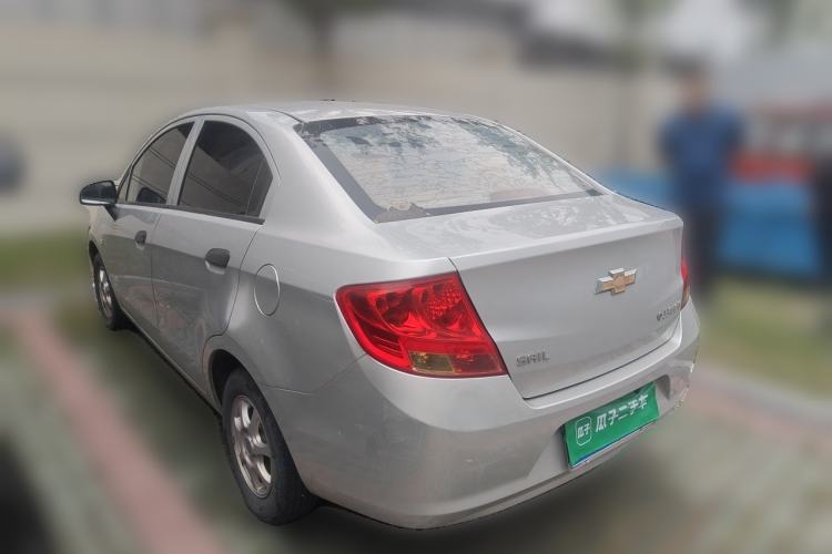 Used Chevrolet Sail 2013 Sedan 1.2L Manual Fashionable Happiness Edition Rear Left 45 Deg