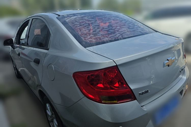 Used Chevrolet Sail 2013 Sedan 1.2L Manual Fashionable Happiness Edition Rear Left 45 Deg