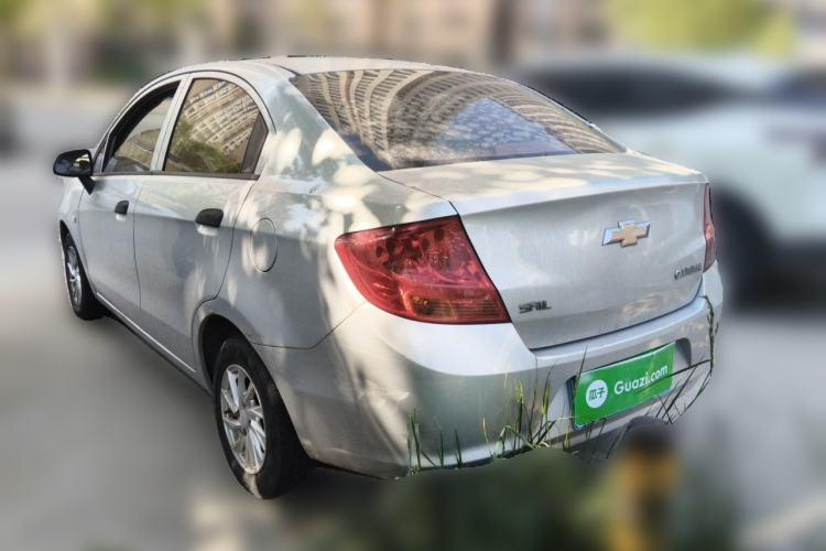 Used Chevrolet Sail 2013 Sedan 1.2L Manual Fashionable Happiness Edition Rear Left 45 Deg