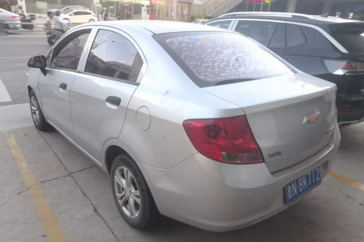 Used Chevrolet Sail 2013 Sedan 1.4L Manual Ideal Happiness Edition Rear Left 45 Deg