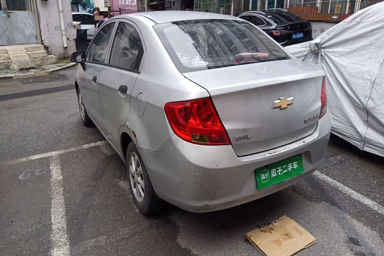 Used Chevrolet Sail 2013 Sedan 1.2L Manual Fashionable Happiness Edition Rear Left 45 Deg