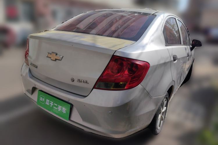 Used Chevrolet Sail 2013 Sedan 1.2L Manual Fashionable Happiness Edition Rear Right 45 Deg