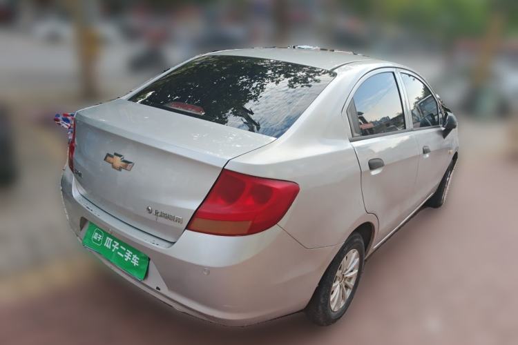 Used Chevrolet Sail 2013 Sedan 1.2L Manual Fashionable Happiness Edition Rear Right 45 Deg