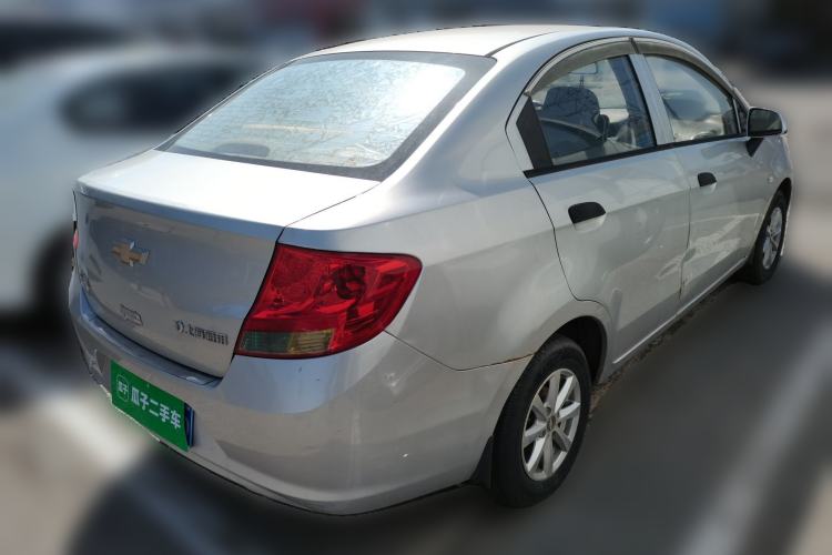 Used Chevrolet Sail 2013 Sedan 1.2L Manual Fashionable Happiness Edition Rear Right 45 Deg