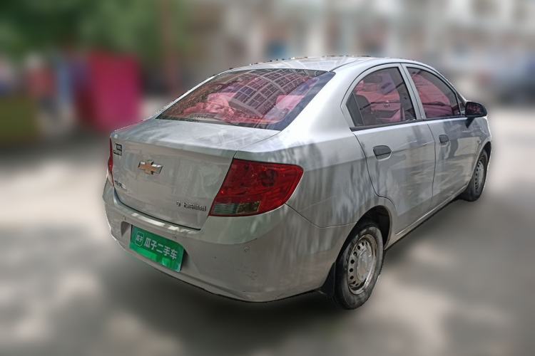 Used Chevrolet Sail 2013 Sedan 1.2L Manual Fashionable Happiness Edition Rear Right 45 Deg