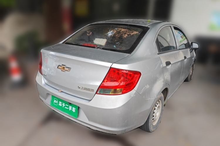Used Chevrolet Sail 2013 Sedan 1.2L Manual Fashionable Happiness Edition Rear Right 45 Deg