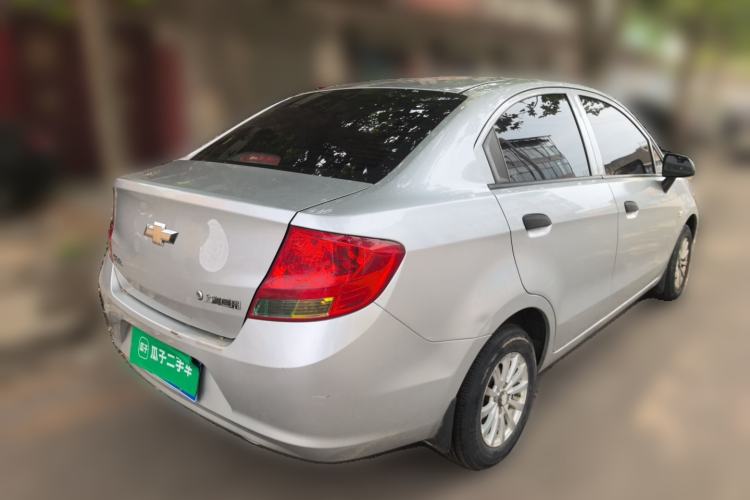 Used Chevrolet Sail 2013 Sedan 1.2L Manual Fashionable Happiness Edition Rear Right 45 Deg
