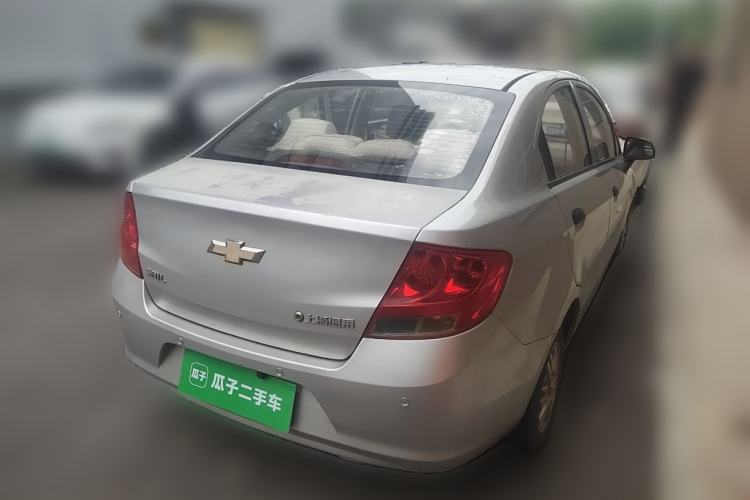 Used Chevrolet Sail 2013 Sedan 1.2L Manual Fashionable Happiness Edition Rear Right 45 Deg