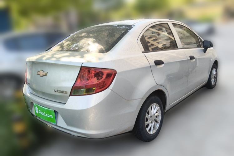 Used Chevrolet Sail 2013 Sedan 1.2L Manual Fashionable Happiness Edition Rear Right 45 Deg