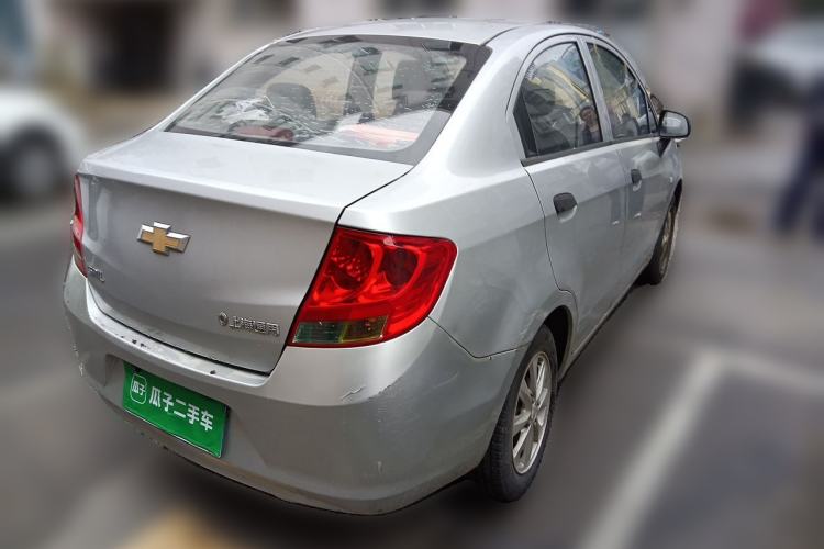 Used Chevrolet Sail 2013 Sedan 1.2L Manual Fashionable Happiness Edition Rear Right 45 Deg