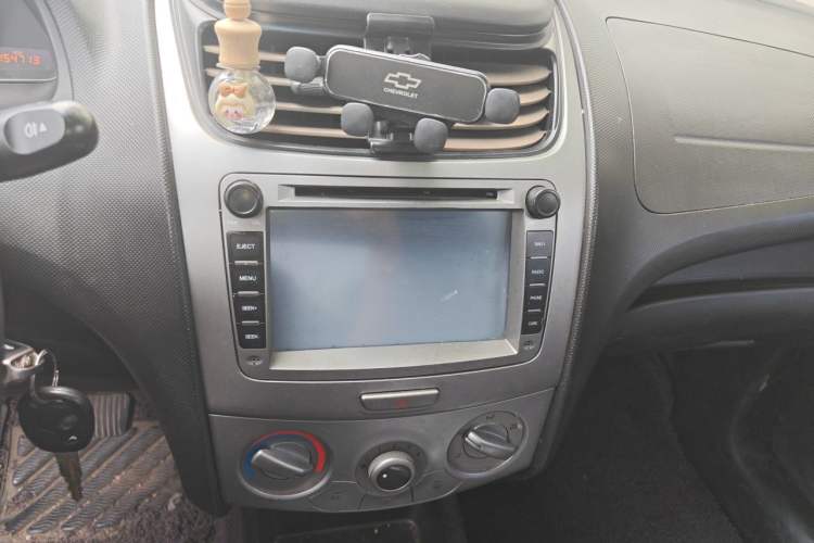 Used Chevrolet Sail 2013 Sedan 1.4L Manual Ideal Happiness Edition Audio And AC Panel