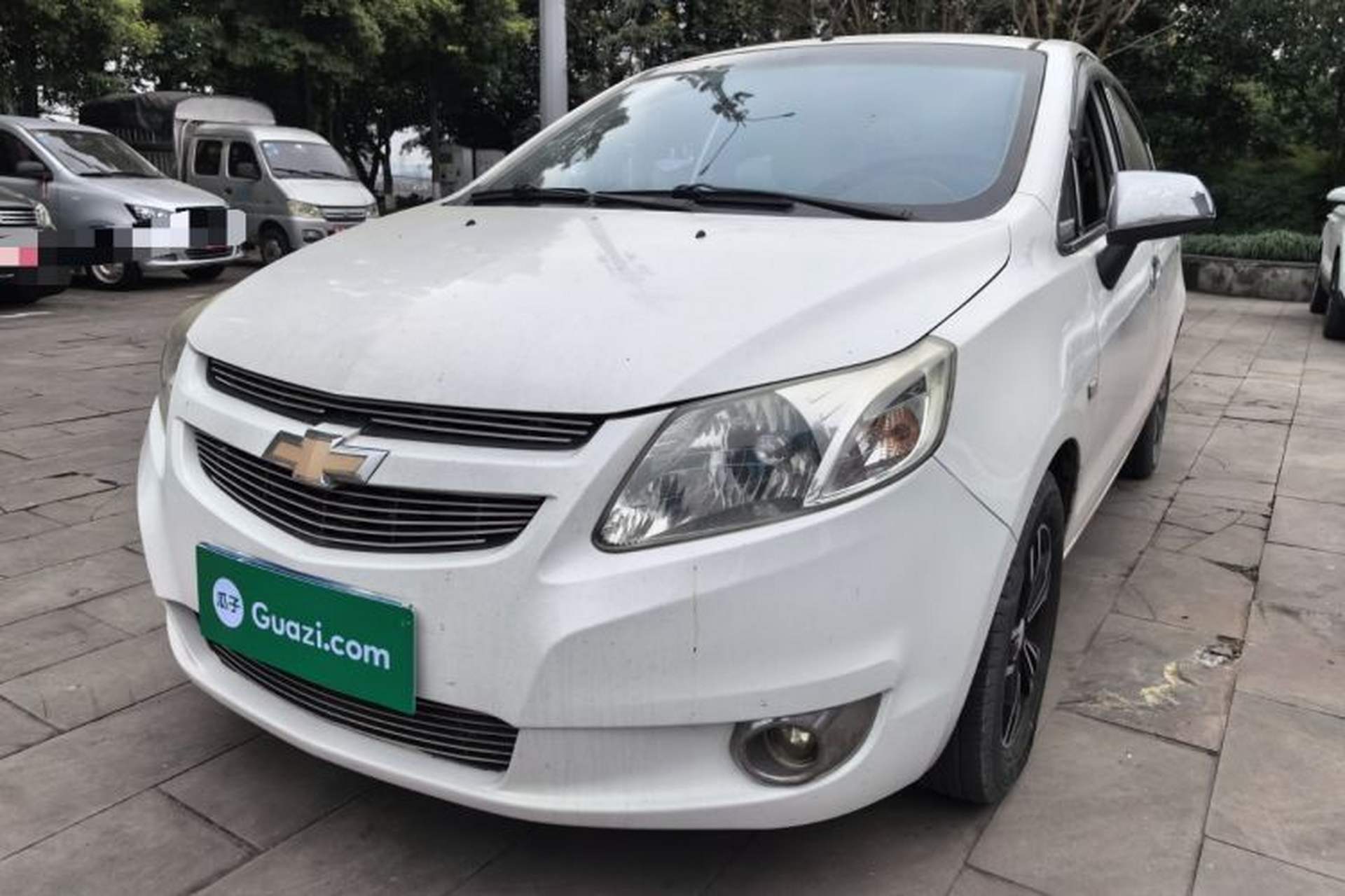 Used Chevrolet Sail 2013 Sedan 1.2L Manual Fashionable Happiness Edition Front Left 45 Deg