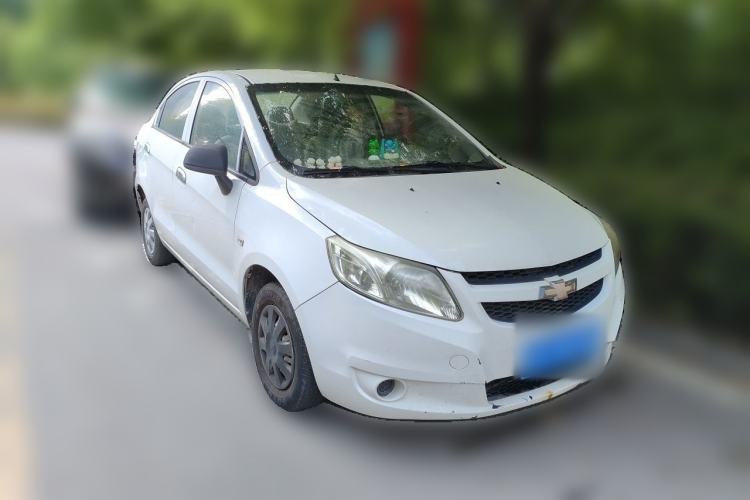 Used Chevrolet Sail 2013 Sedan 1.2L Manual Fashionable Happiness Edition Front Right 45 Deg