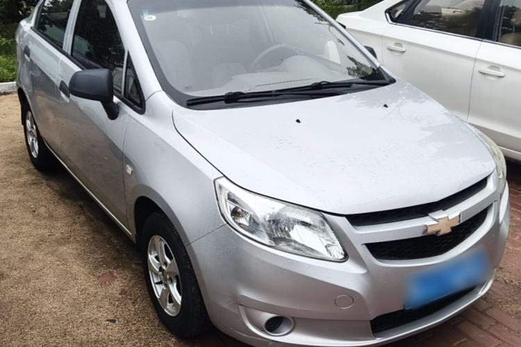 Used Chevrolet Sail 2013 Sedan 1.2L Manual Fashionable Happiness Edition Front Right 45 Deg