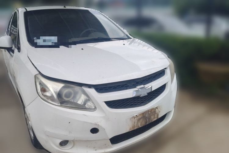 Used Chevrolet Sail 2013 Sedan 1.4L Manual Happiness Edition II Front Right 45 Deg