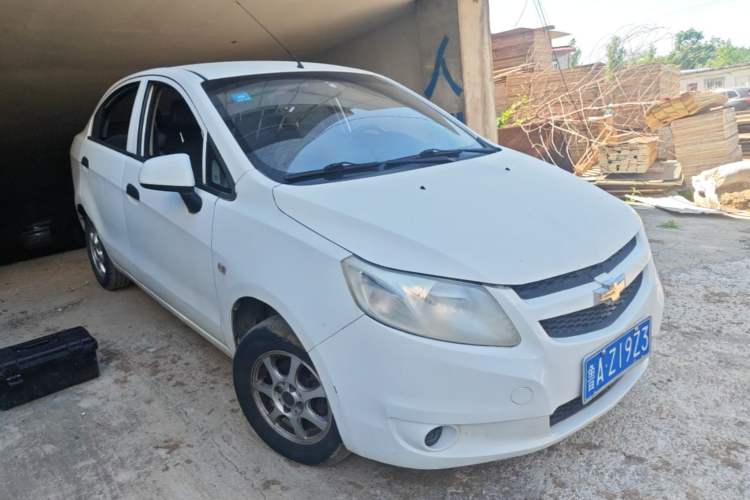 Used Chevrolet Sail 2013 Sedan 1.2L Manual Fashionable Happiness Edition Front Right 45 Deg