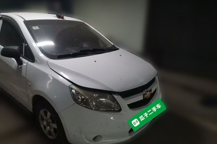 Used Chevrolet Sail 2013 Sedan 1.2L Manual Fashionable Happiness Edition Front Right 45 Deg
