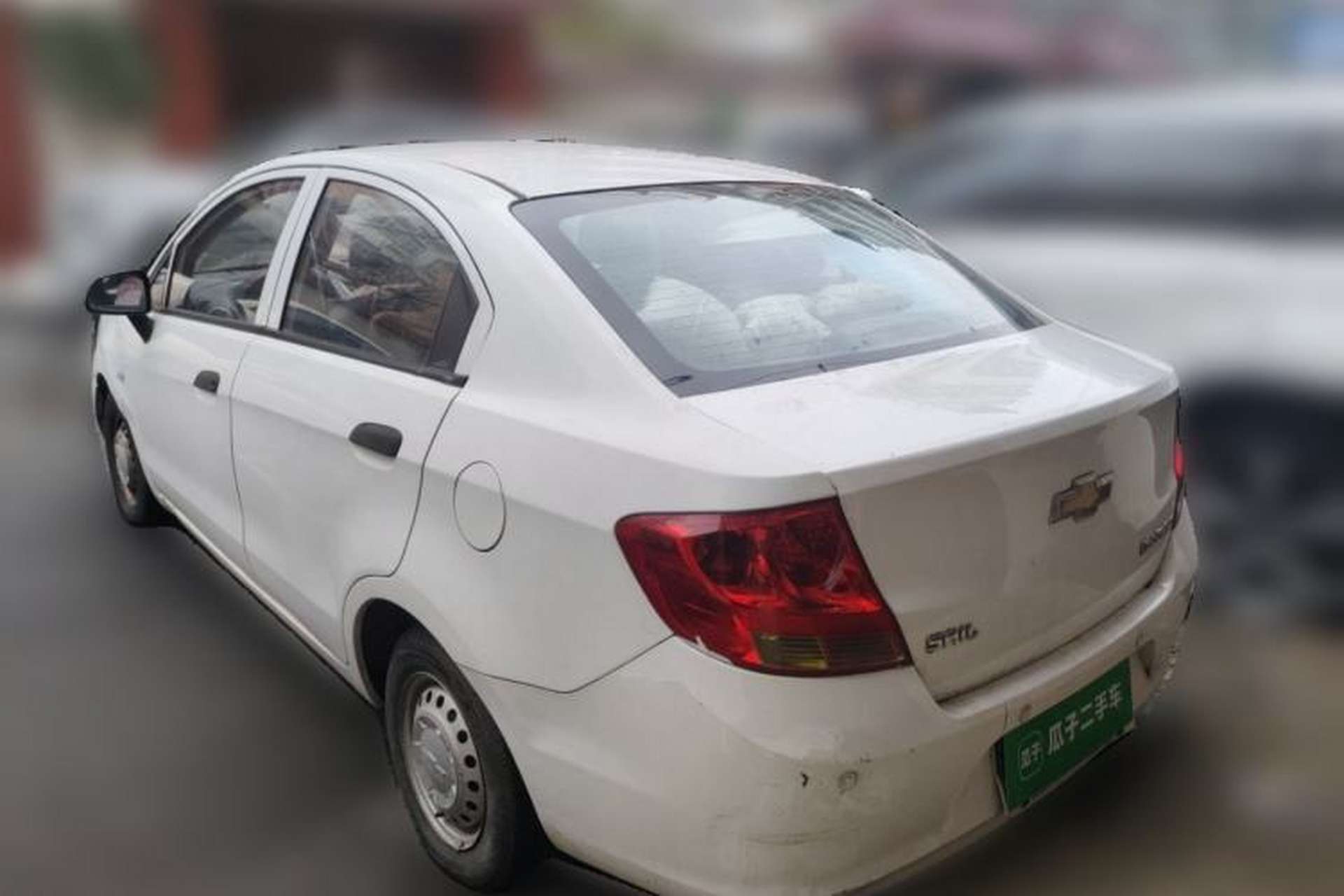 Used Chevrolet Sail 2013 Sedan 1.2L Manual Fashionable Happiness Edition Rear Left 45 Deg