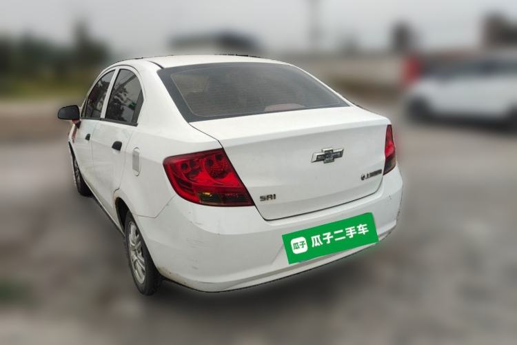 Used Chevrolet Sail 2013 Sedan 1.4L Manual Ideal Happiness Edition Rear Left 45 Deg