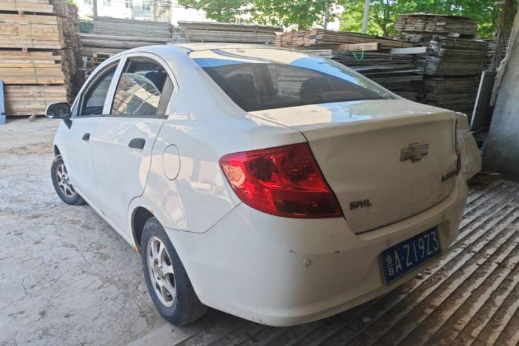 Used Chevrolet Sail 2013 Sedan 1.2L Manual Fashionable Happiness Edition Rear Left 45 Deg