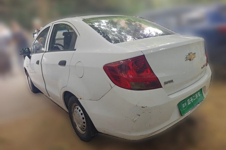 Used Chevrolet Sail 2013 Sedan 1.2L Manual Fashionable Happiness Edition Rear Left 45 Deg
