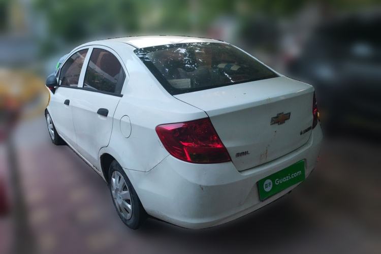 Used Chevrolet Sail 2013 Sedan 1.4L Manual Ideal Happiness Edition Rear Left 45 Deg